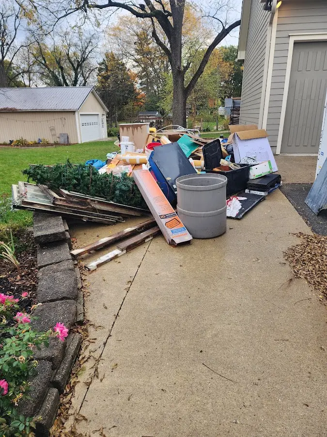 Dumpster being loaded with debris for Roofing Dumpster Rental in Port St. Lucie